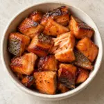 Square bowl of hot-smoked maple candied salmon bites