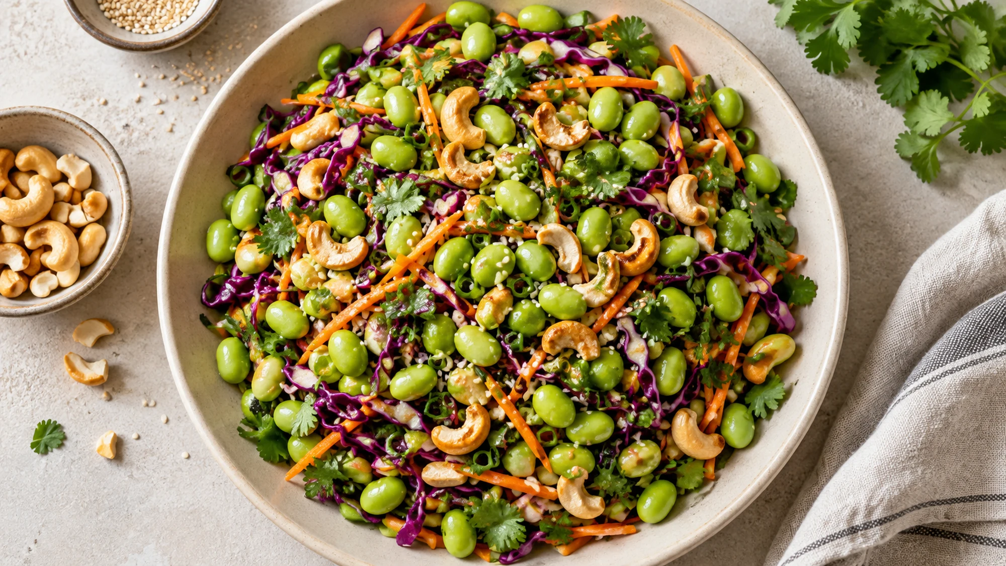 Overhead view of colorful edamame crunch salad on a shallow platter