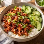 Gochujang ground chicken bowl with rice cucumber and sesame