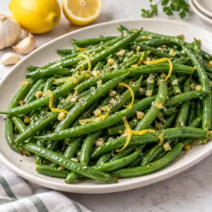 Square platter of green beans with garlic and lemon
