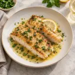 Square view of golden mahi mahi fillets with lemon butter.