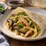 Moo shu chicken with cabbage mushrooms and egg ribbons