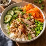 Square close-up of the finished rotisserie chicken rice bowl.