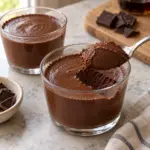 silken tofu chocolate mousse showing a spoon revealing the silky dense chocolate texture